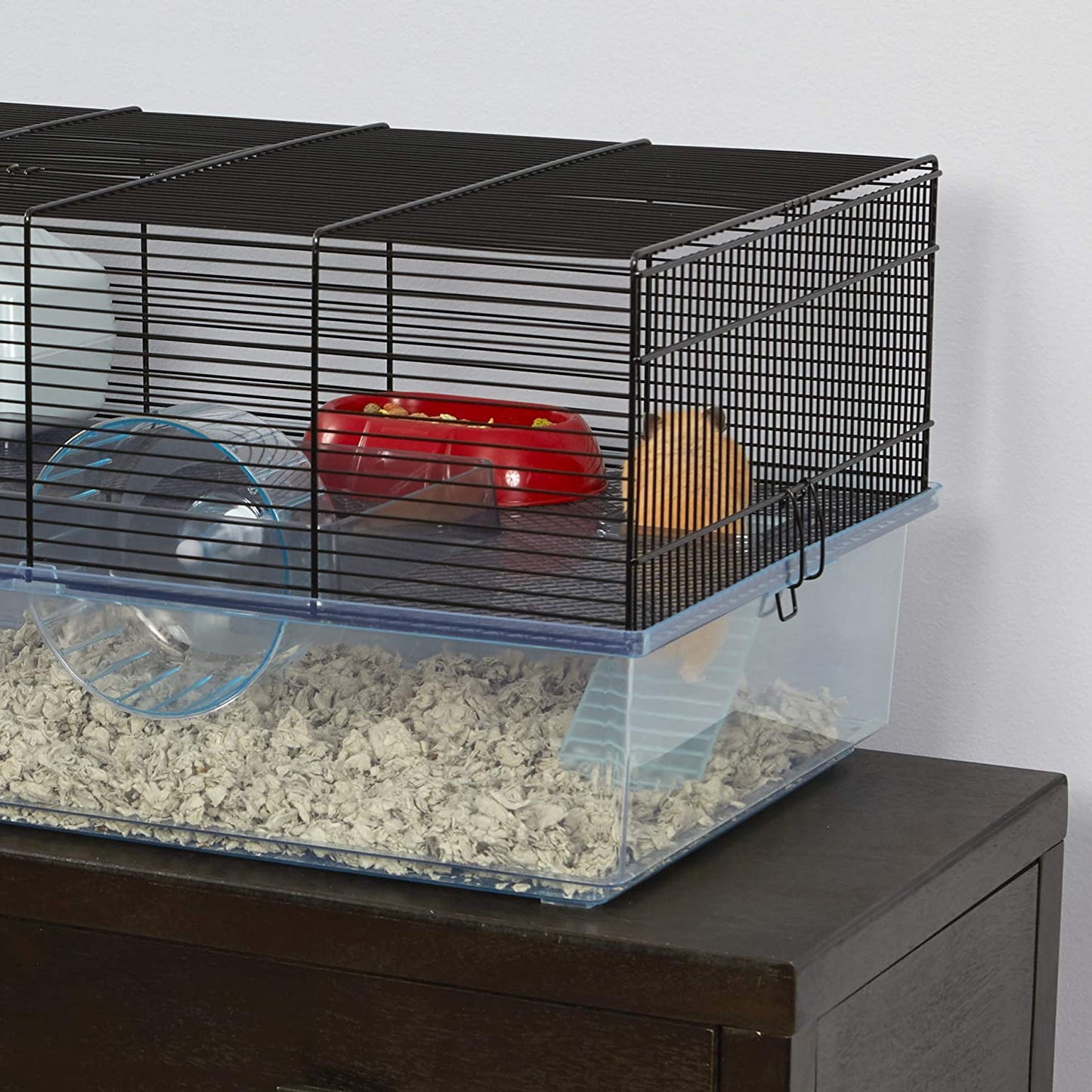 Hamster cage includes water bottle, wheel, tray